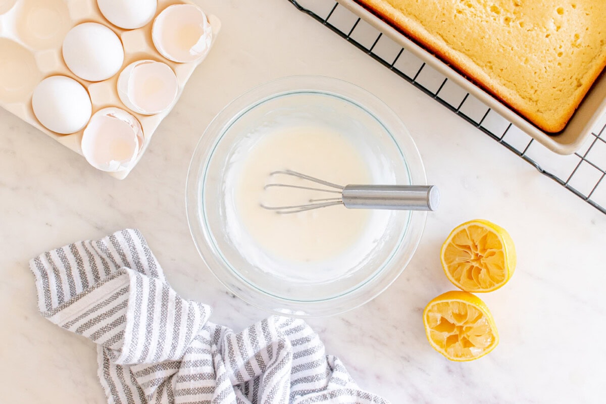 lemon glaze in a bowl with a whisk