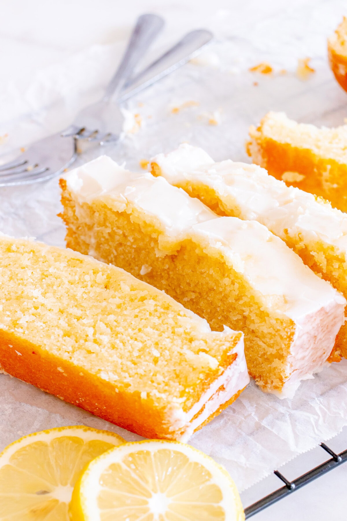 Slices of Lemon Pound Cake on parchment paper