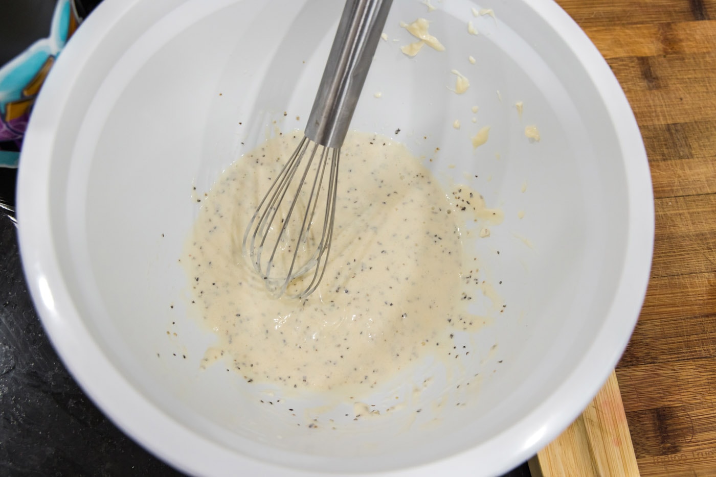 whisking mayo dressing in a bowl