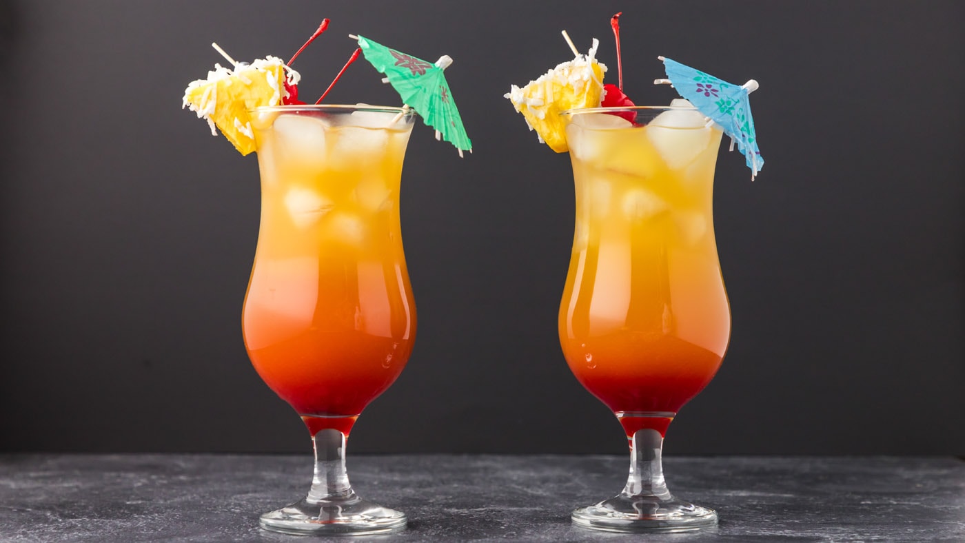 Sweet, fruity, and tropical flavors are layered into this Malibu sunset cocktail with contrasting co