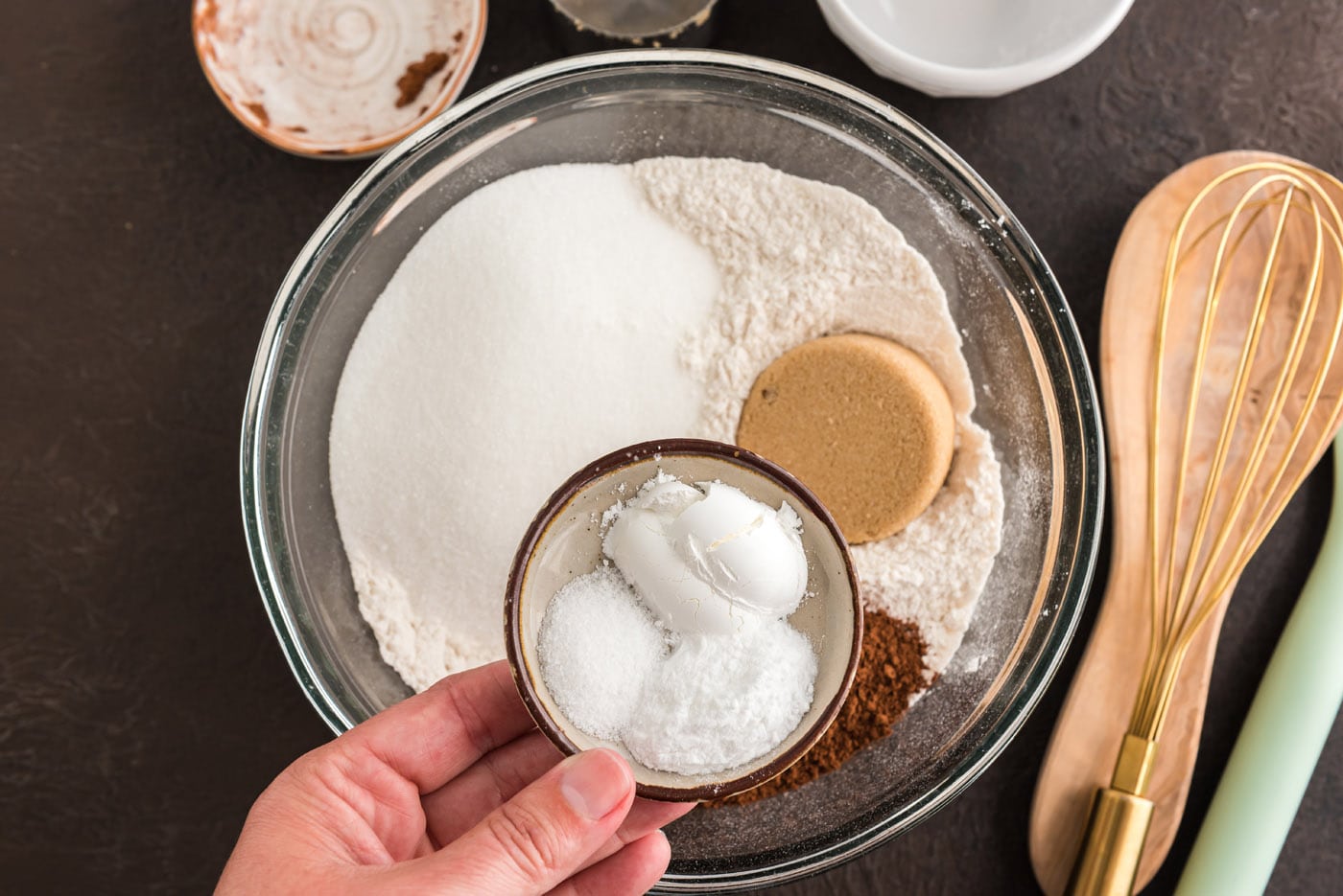 flour, sugar, cocoa powder, salt, baking powder and baking soda added to bowl