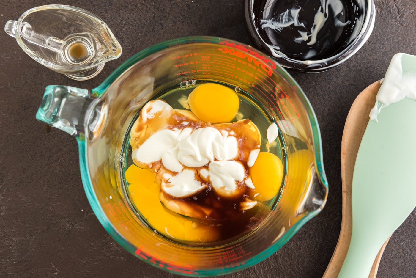 eggs, sour cream, and vanilla in a bowl