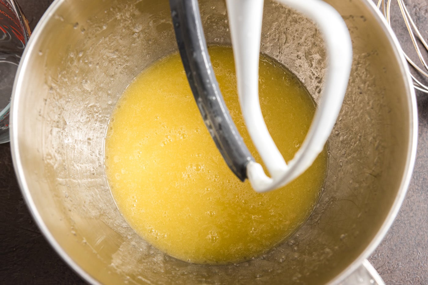 combining melted butter and canola oil in a bowl