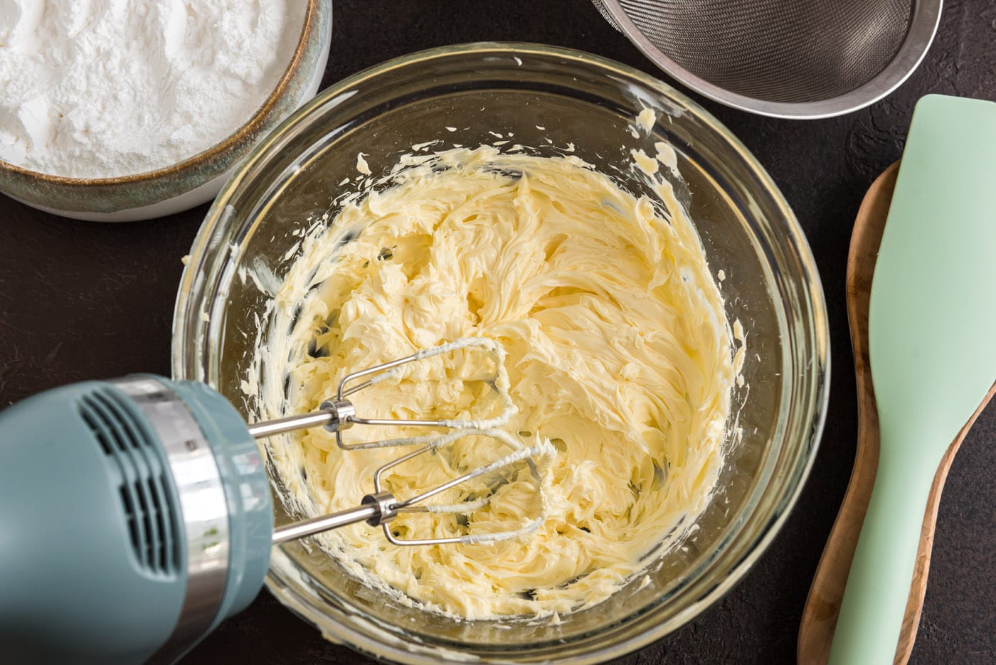 beating butter with a hand mixer
