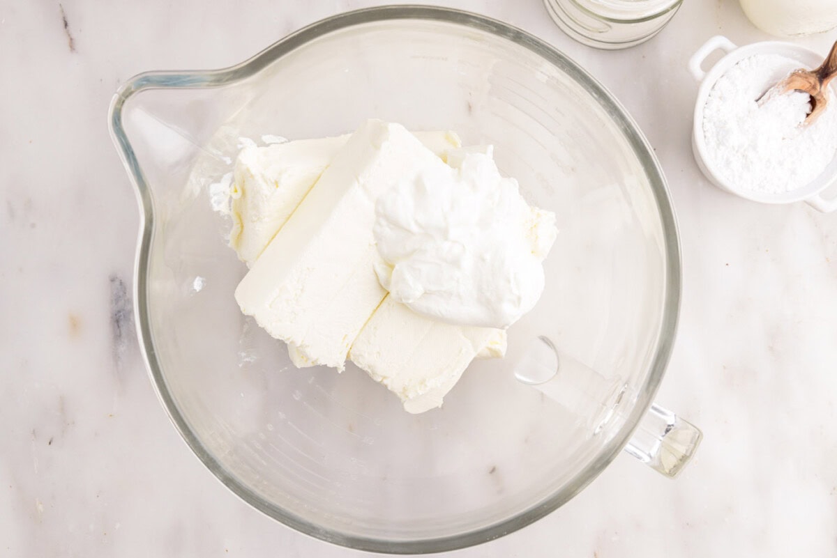 cream cheese and sour cream in a mixing bowl