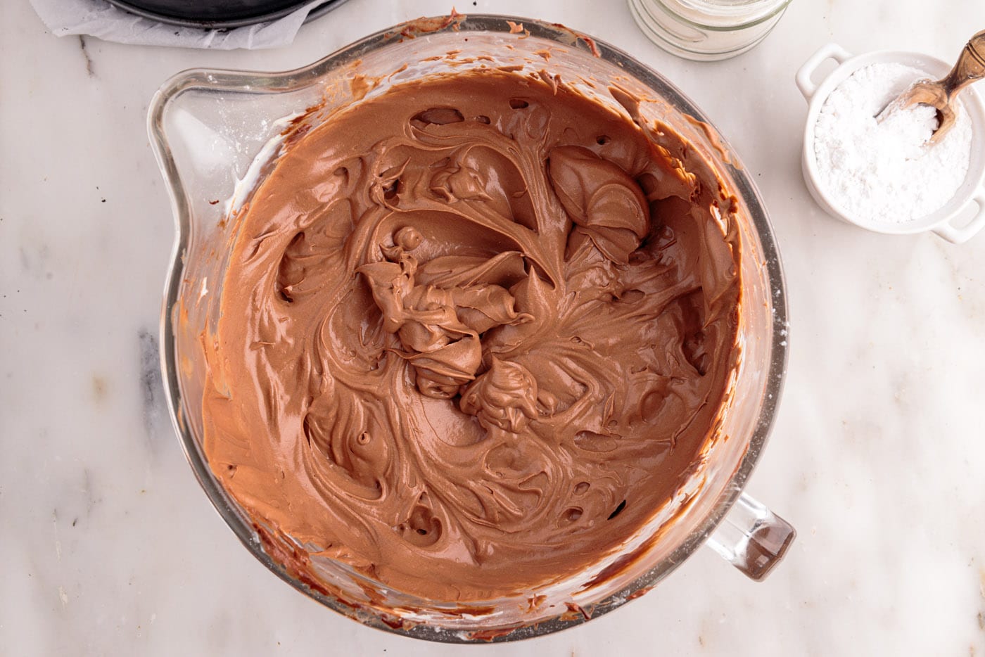 chocolate cheesecake mixture in a mixing bowl