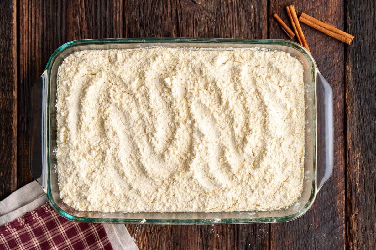 dry cake mix spread evenly over pumpkin batter
