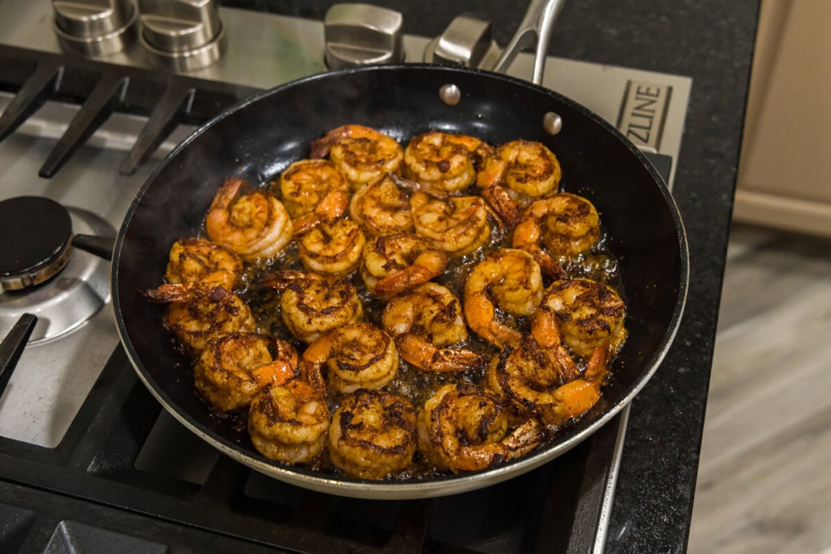 cooked seasoned shrimp in a skillet