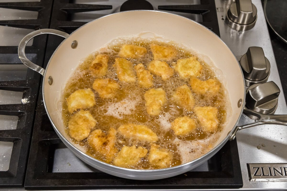 frying cubed chicken in oil