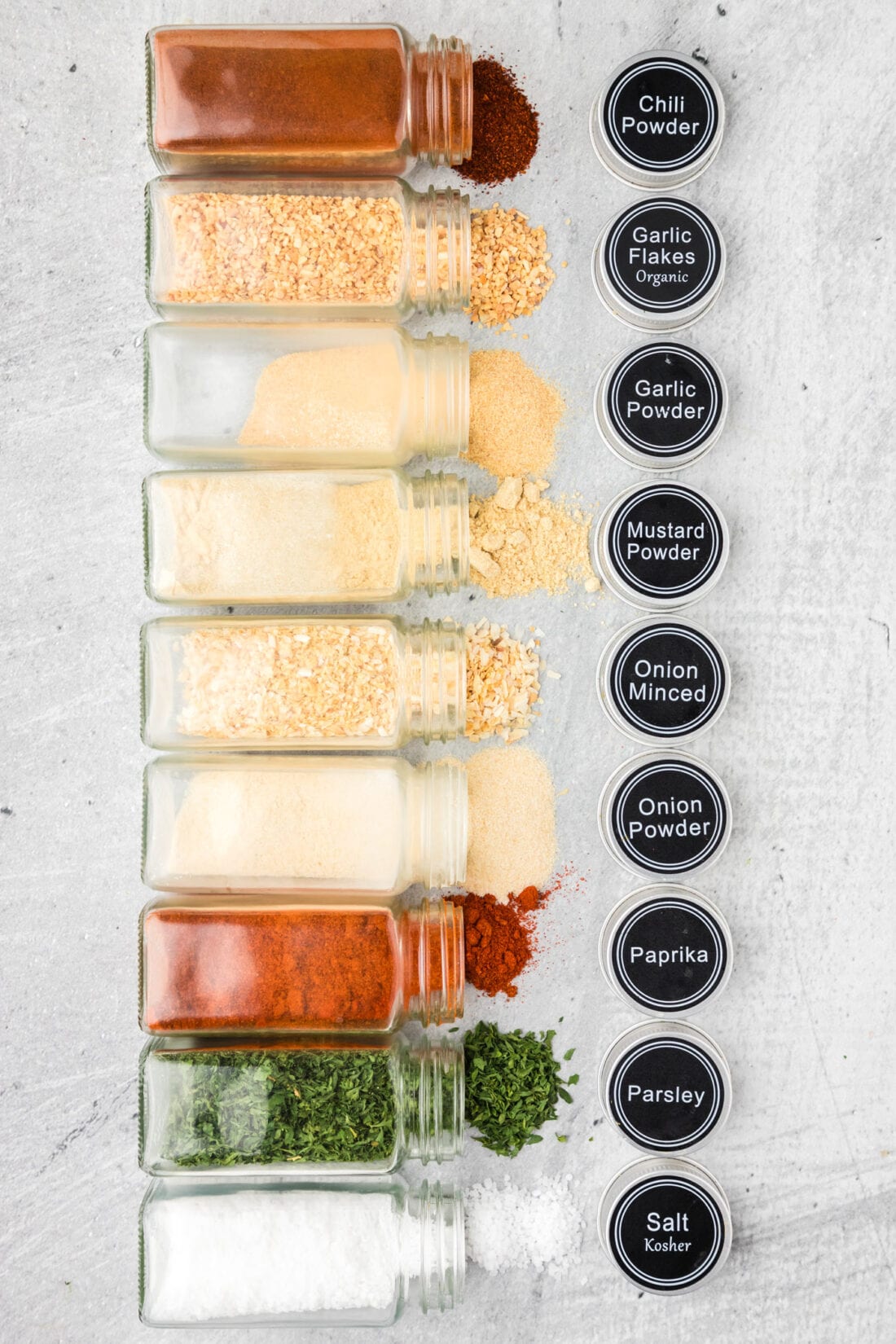 Spice jars of seasonings needed to create All Purpose Seasoning