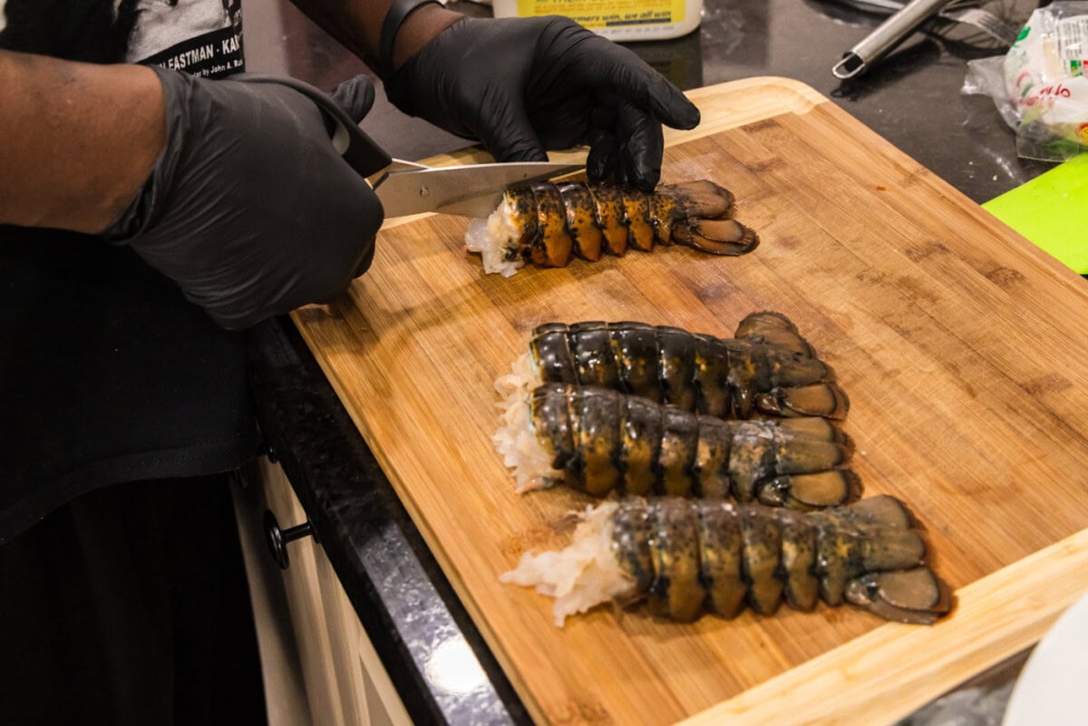 using kitchen shears to slice through lobster shell