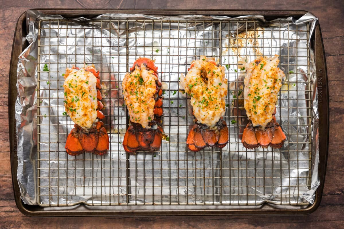 baked lobster tails on a wire rack