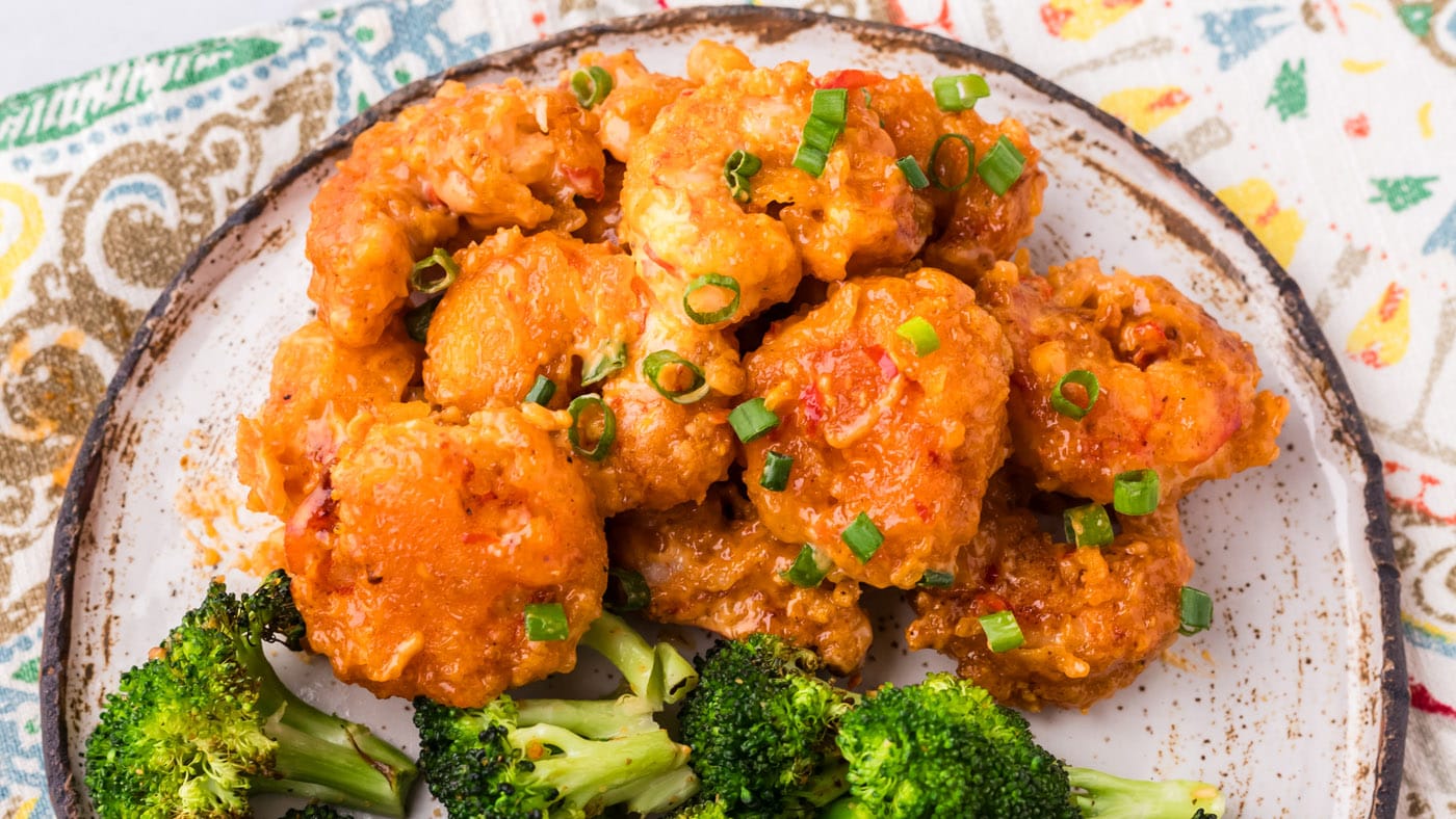 Bang bang shrimp brings the heat AND the flavor. All you have to do is dunk, fry, then toss in spicy