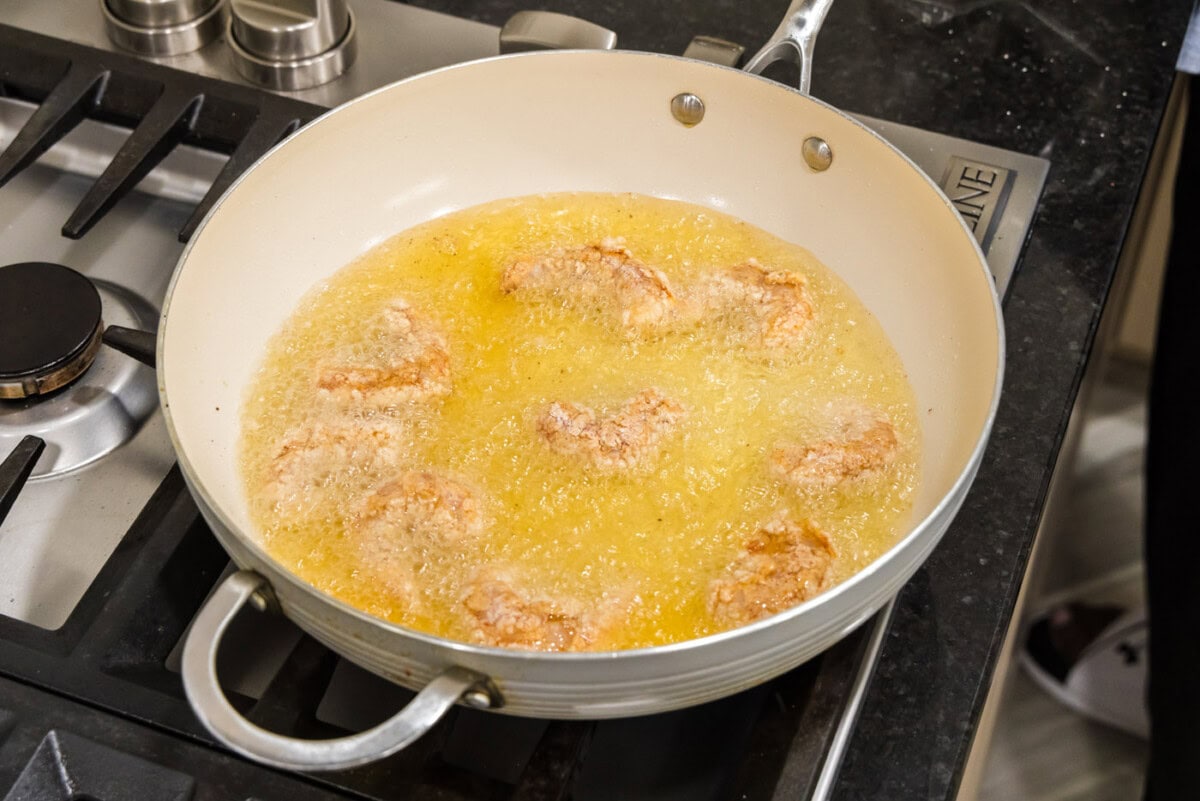 deep frying coated shrimp in oil