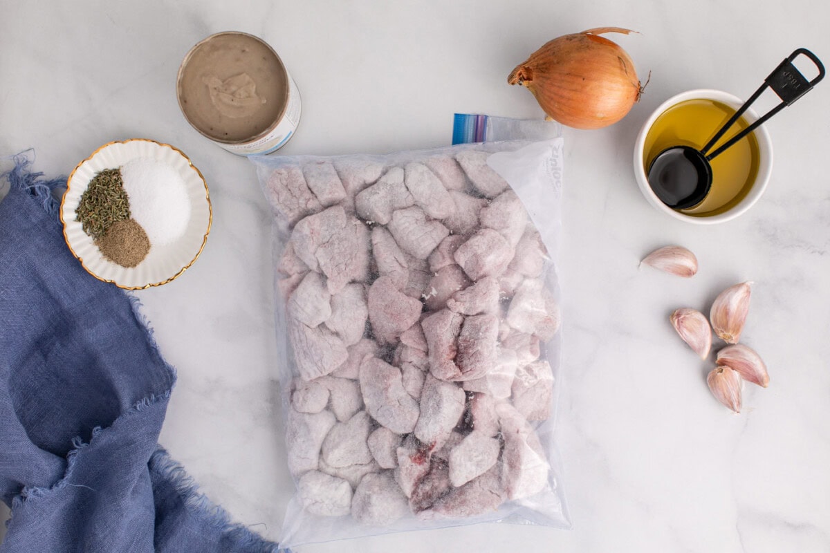 beef stew meat chunks in a bag with flour