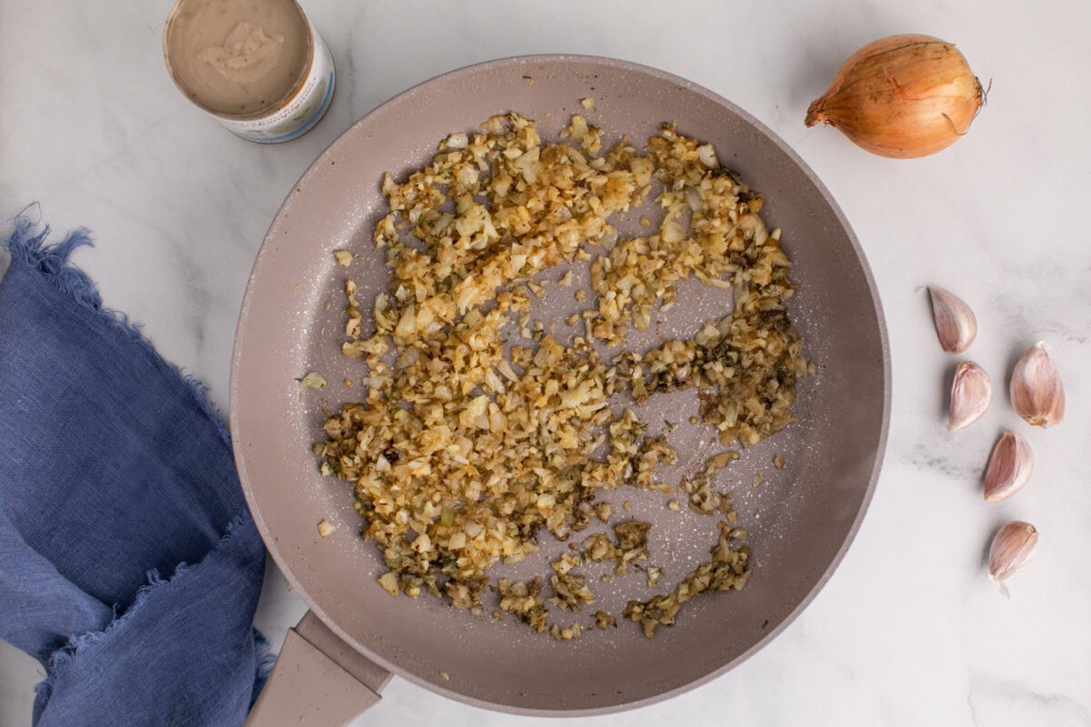 tender onions, seasonings, and garlic in a skillet