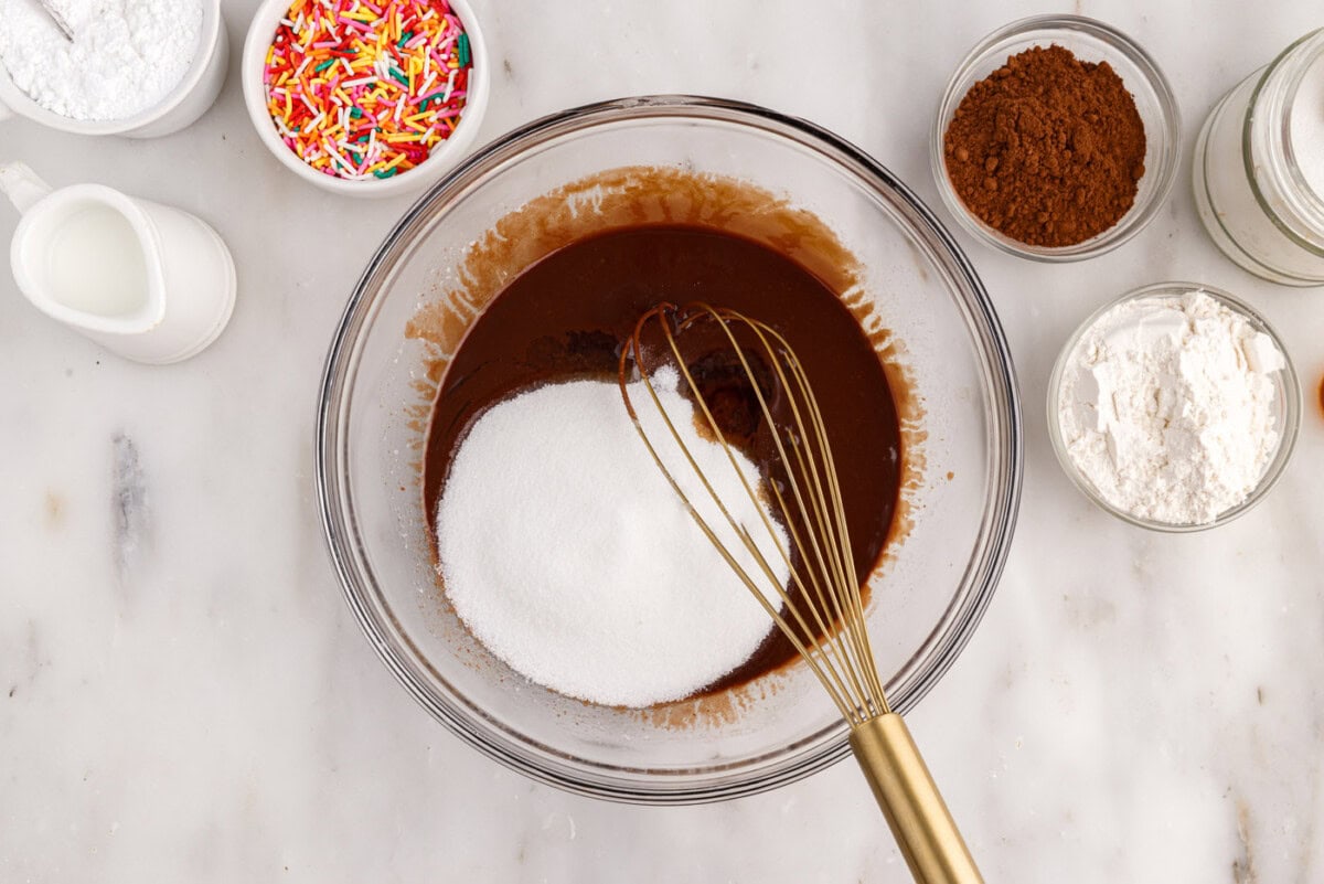 whisking sugar into chocolate mixture