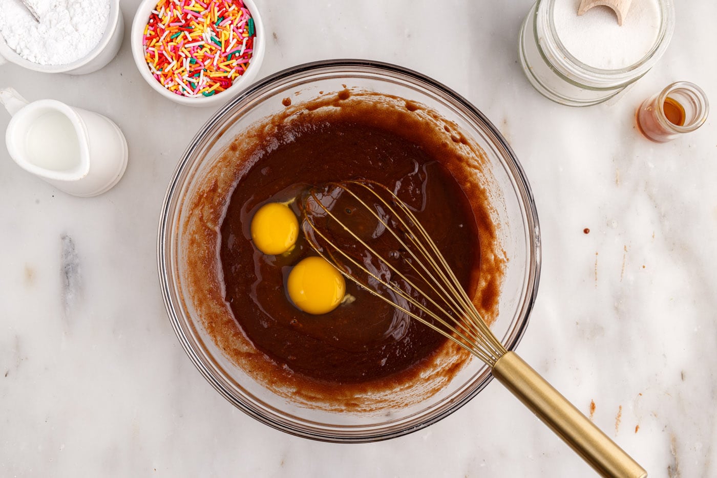 whisking eggs into chocolate mixture