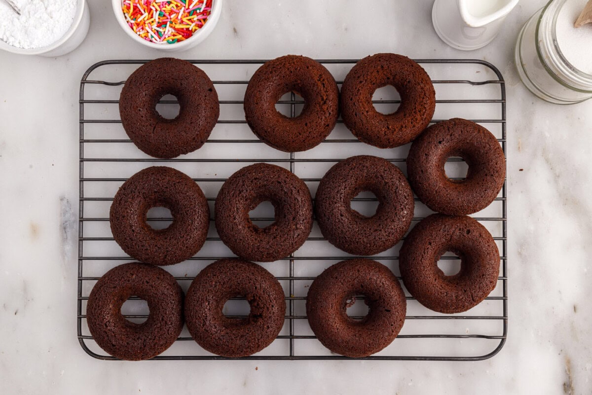 chocolate donuts on a wire cooling rack