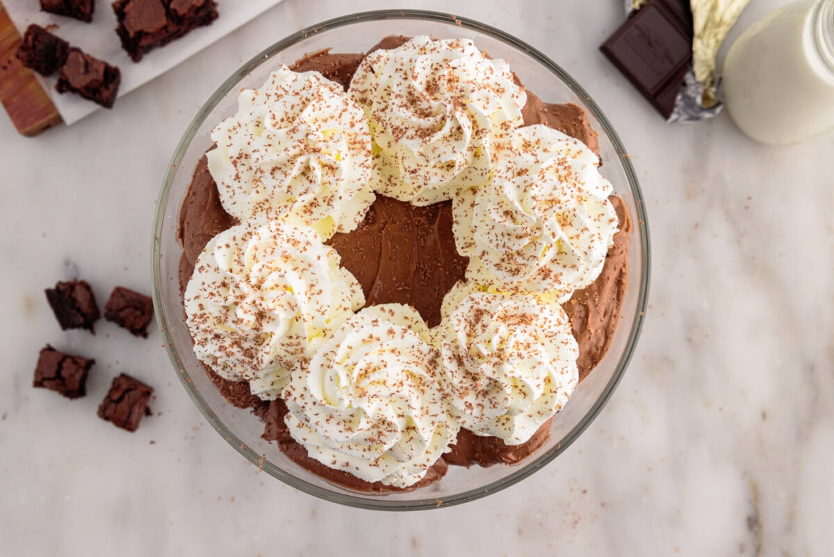 brownie trifle with piped whipped cream and chocolate shavings