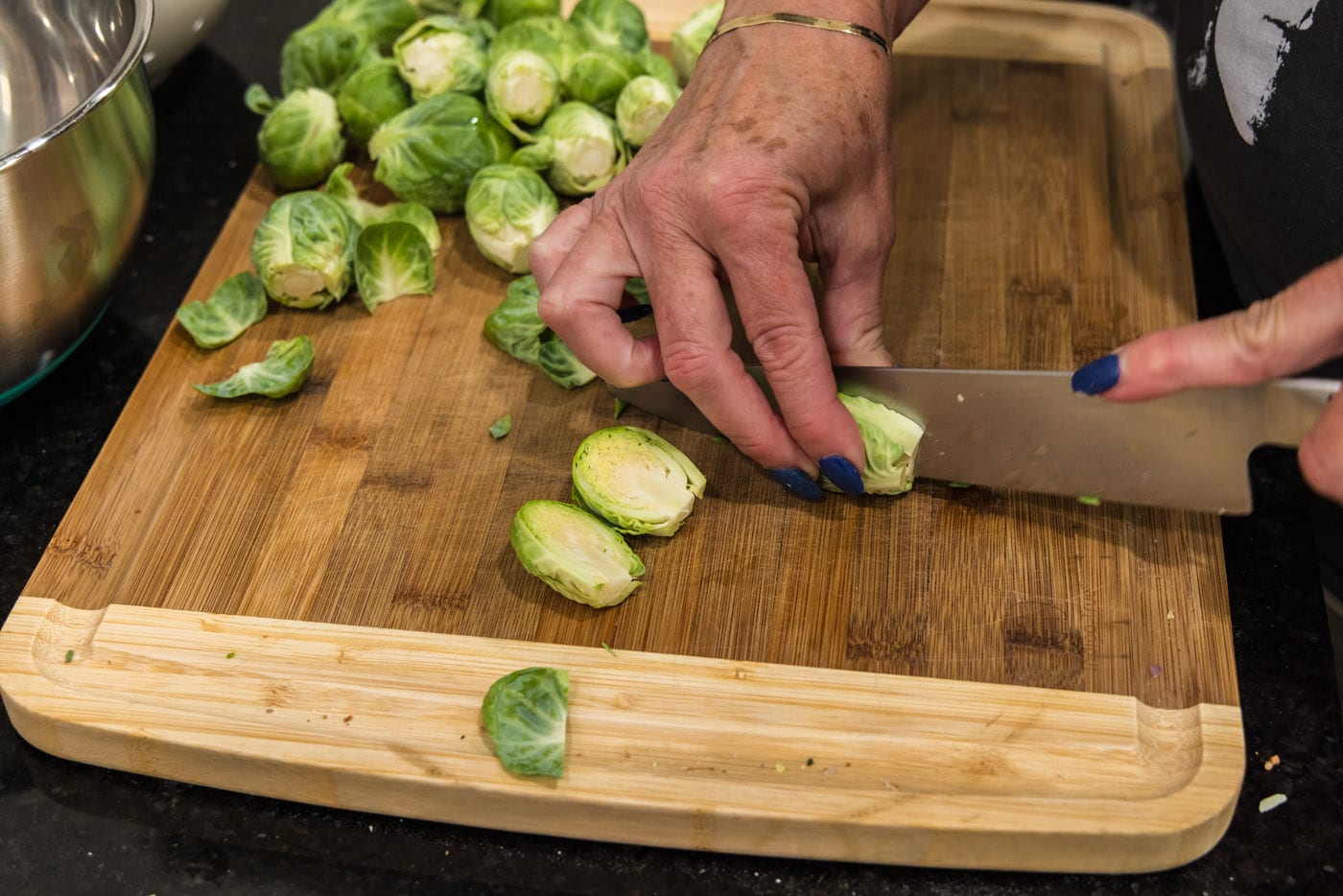 slicing brussels sprouts in half lengthwise