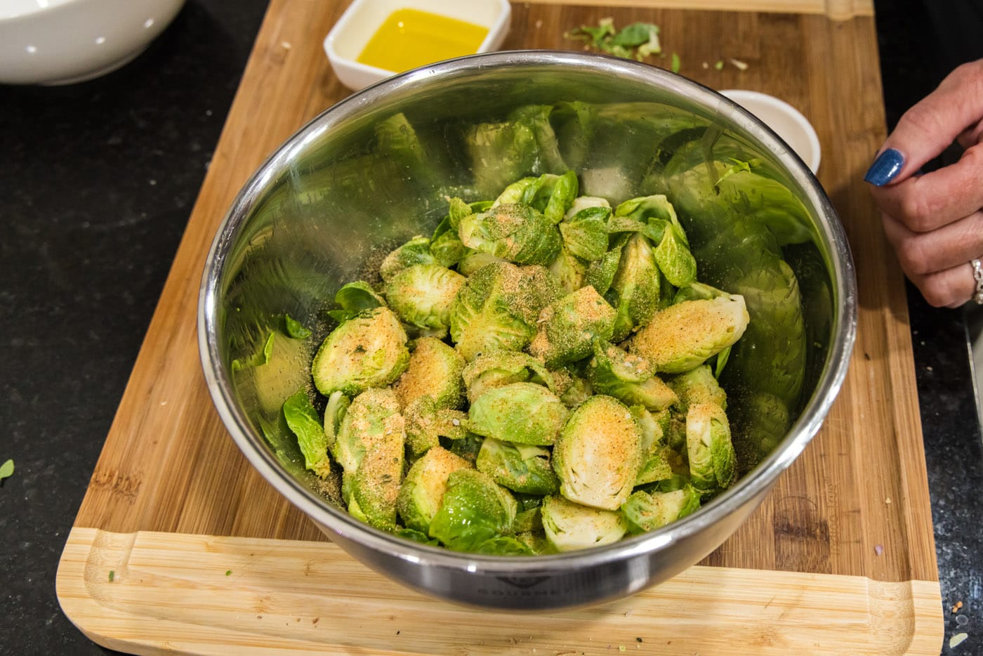 brussels sprouts in a bowl with seasoning