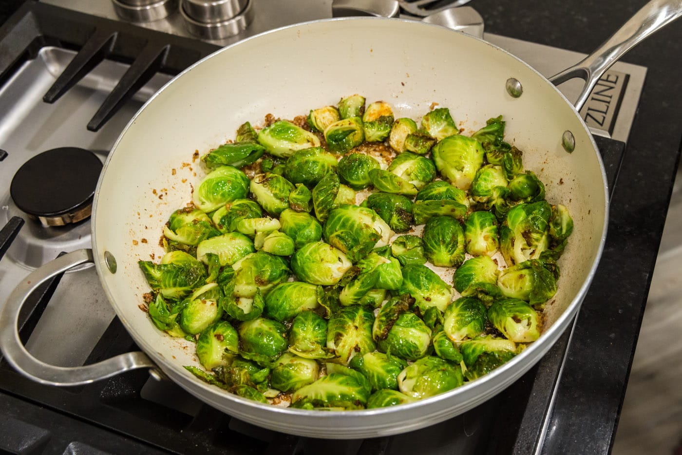 brussel sprouts cooking in a skillet