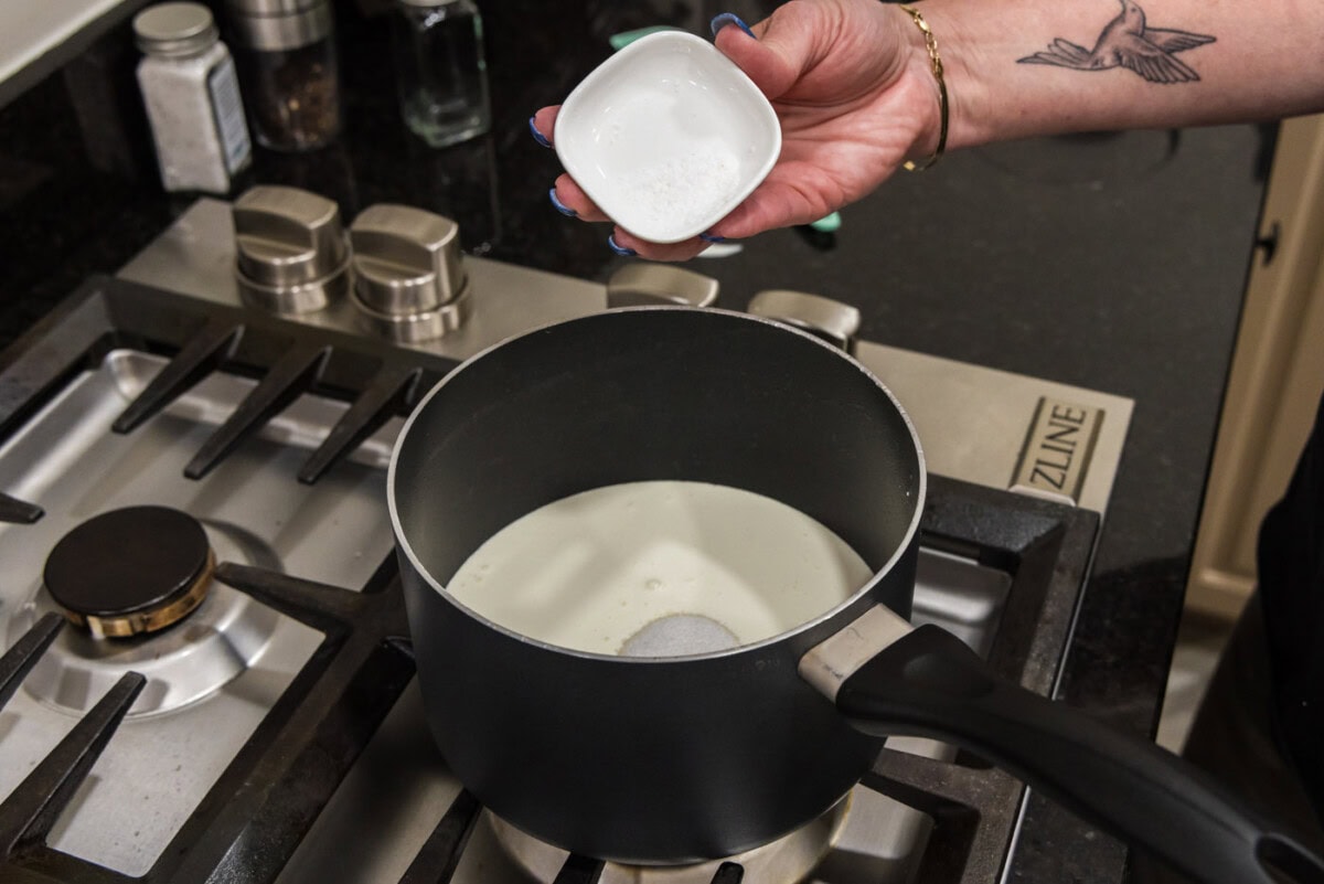 heavy cream, salt, and sugar added to saucepan