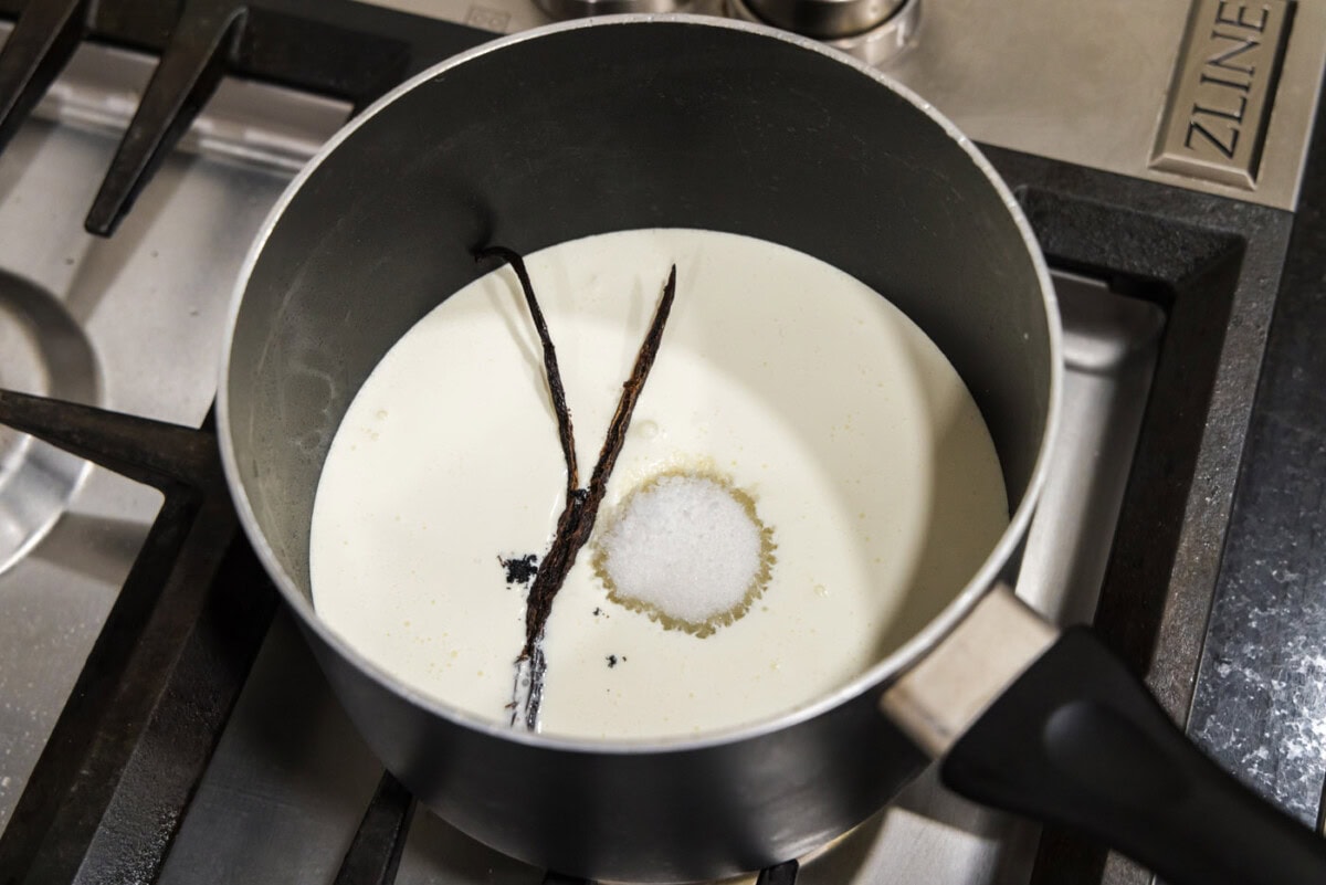 vanilla bean added to saucepan with sugar