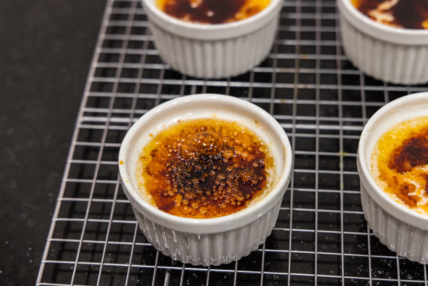 torched creme brulee on a wire rack
