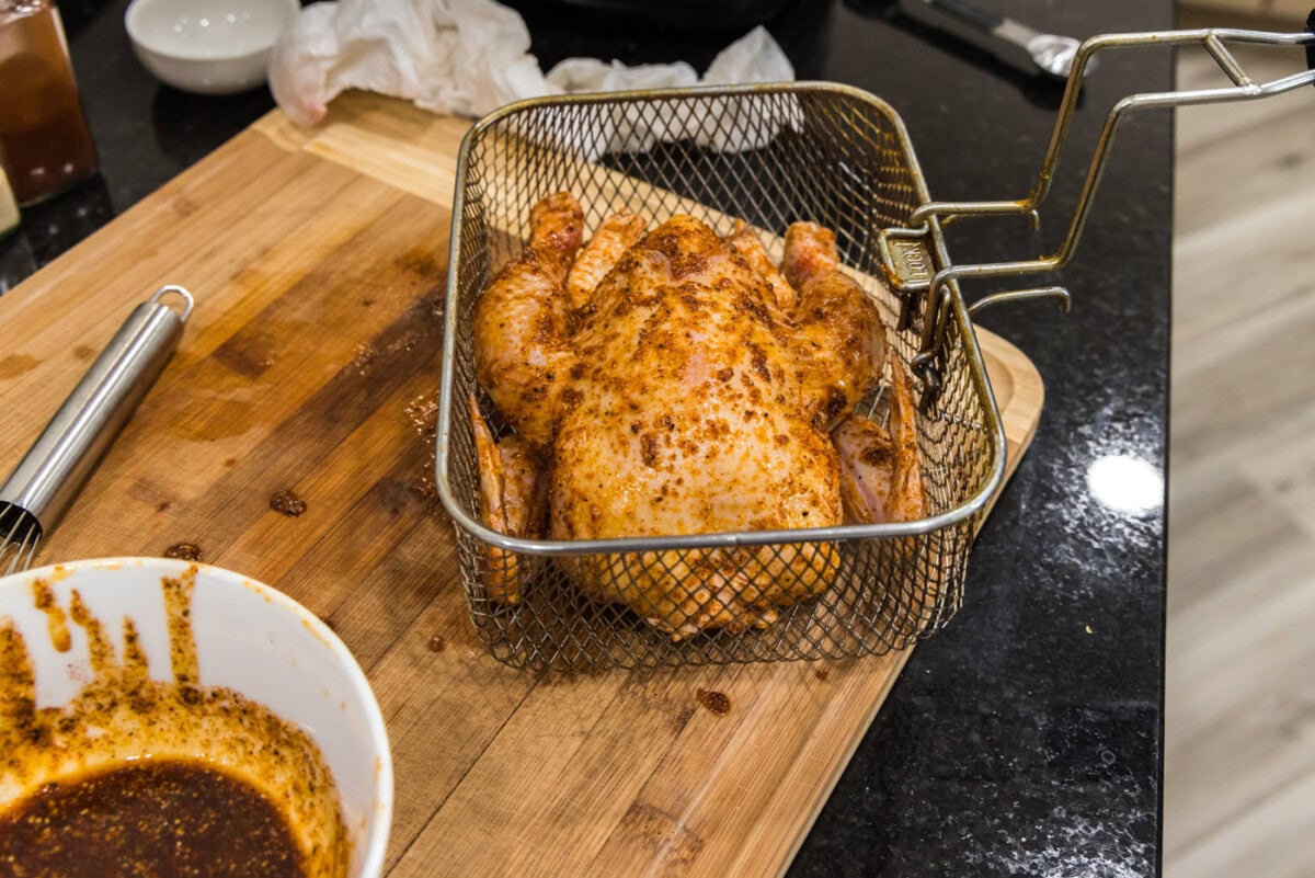 cornish hen in a deep fryer basket