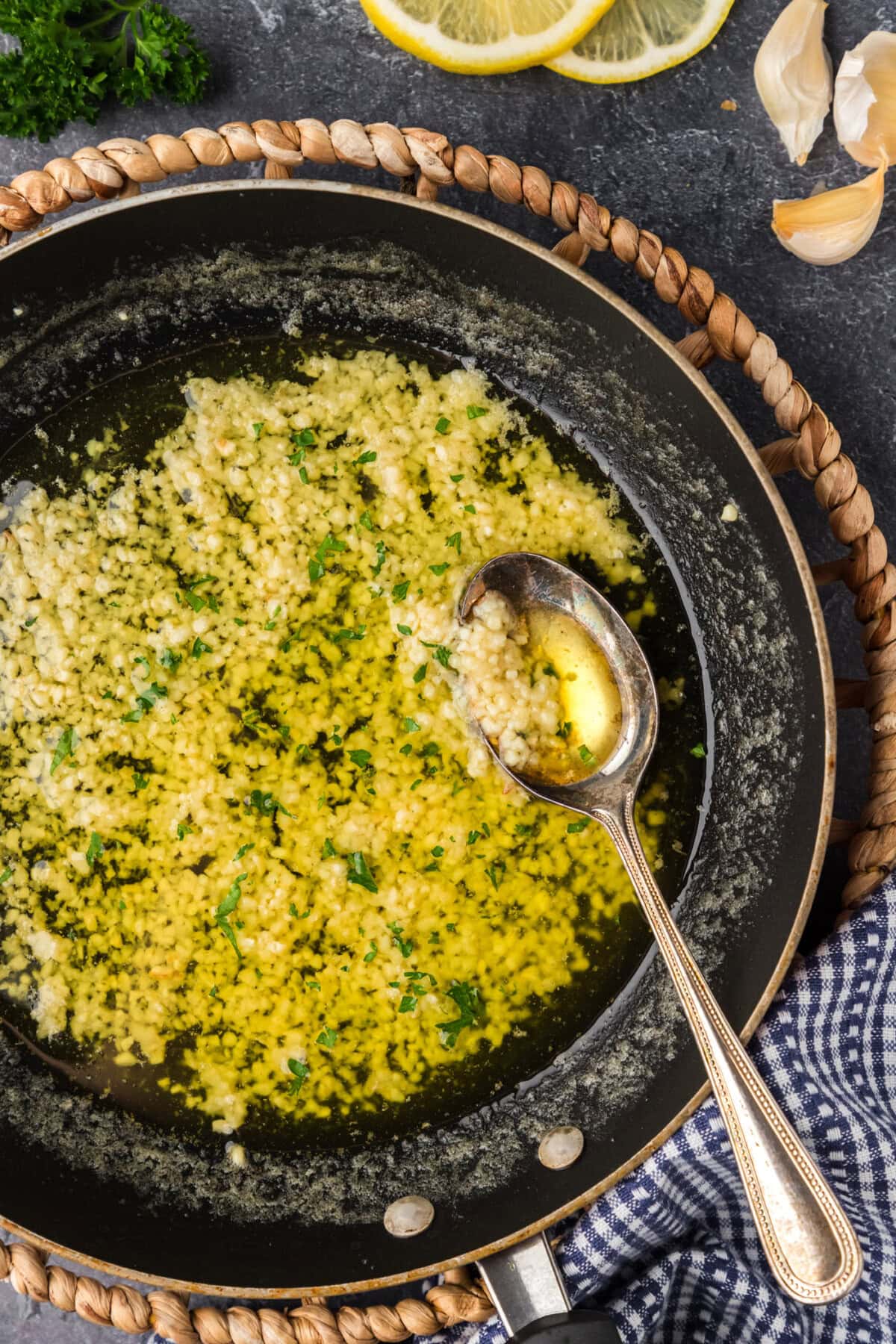 Skillet of Garlic Butter Sauce with a spoon in it
