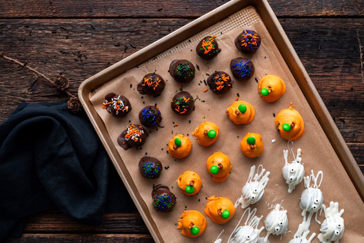 Halloween oreo truffles on a baking sheet