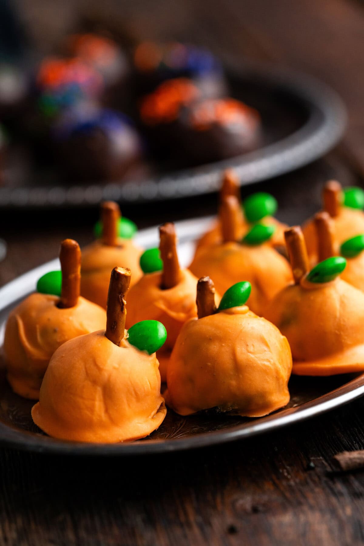 Close up photo of pumpkin oreo truffles on a platter