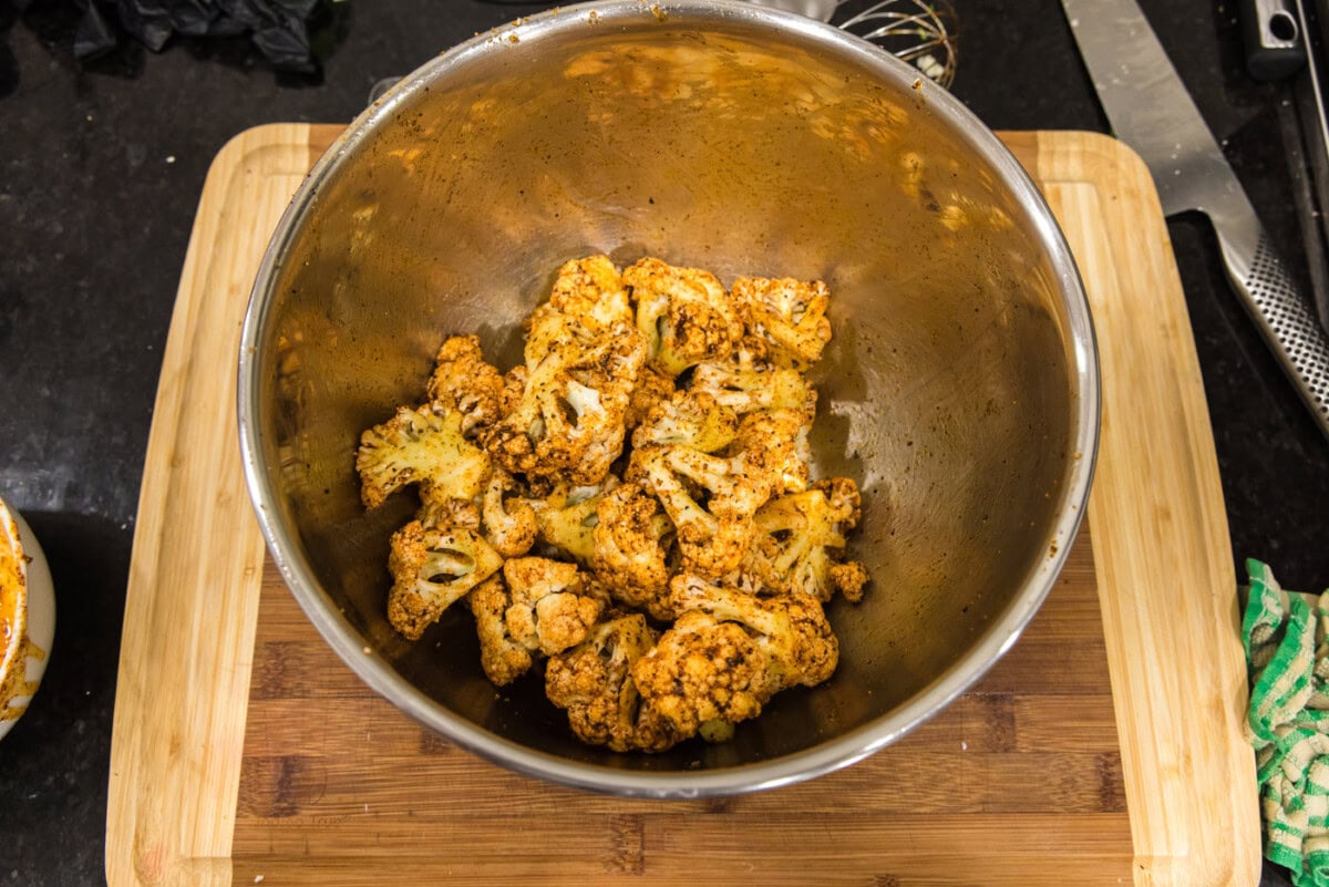 seasoned cauliflower florets in a bowl