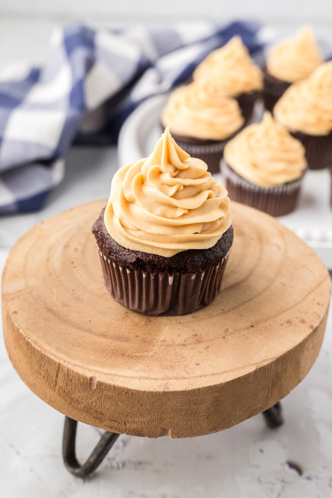 Close up photo of a cupcake topped with Peanut Butter Frosting