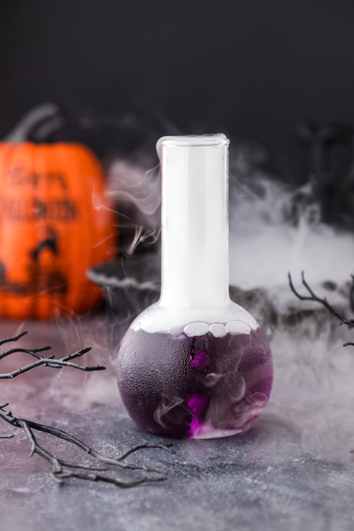 Purple People Eater Cocktail in a beaker glass