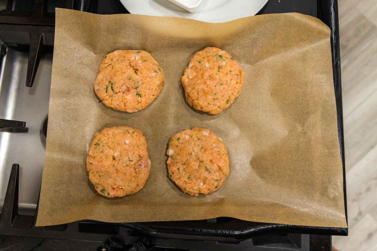 salmon patties on parchment paper