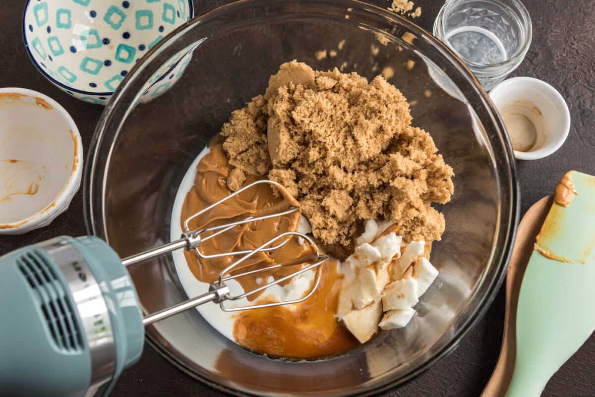 peanut butter cookies ingredients in a bowl with a mixer