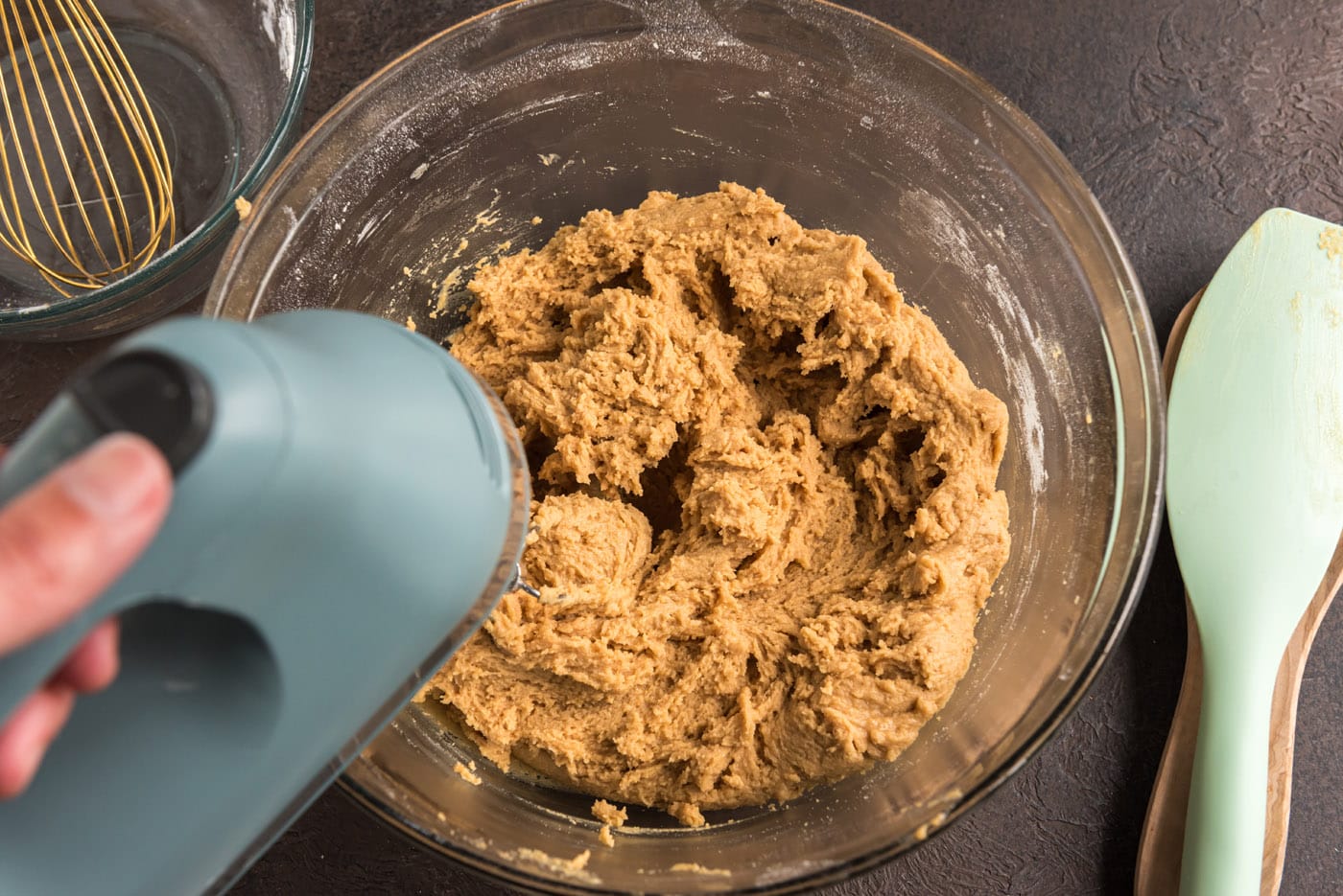 mixing peanut butter cookie dough with an electric mixer