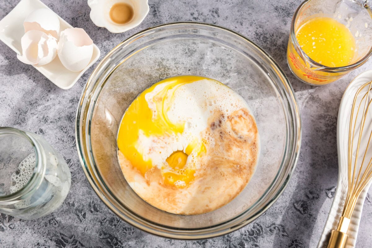 eggs, vanilla, milk, and melted butter in a bowl
