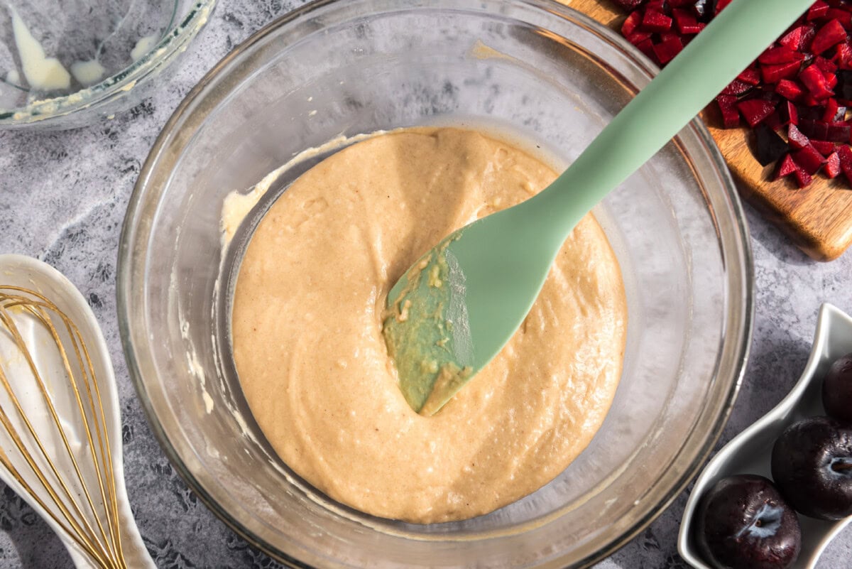plum muffin batter in a bowl