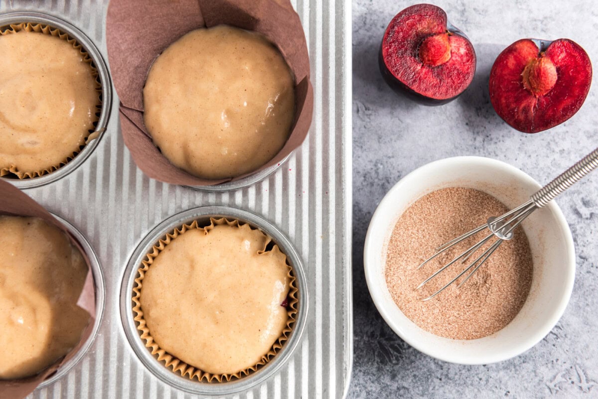 cinnamon sugar mixture next to plum muffin batter