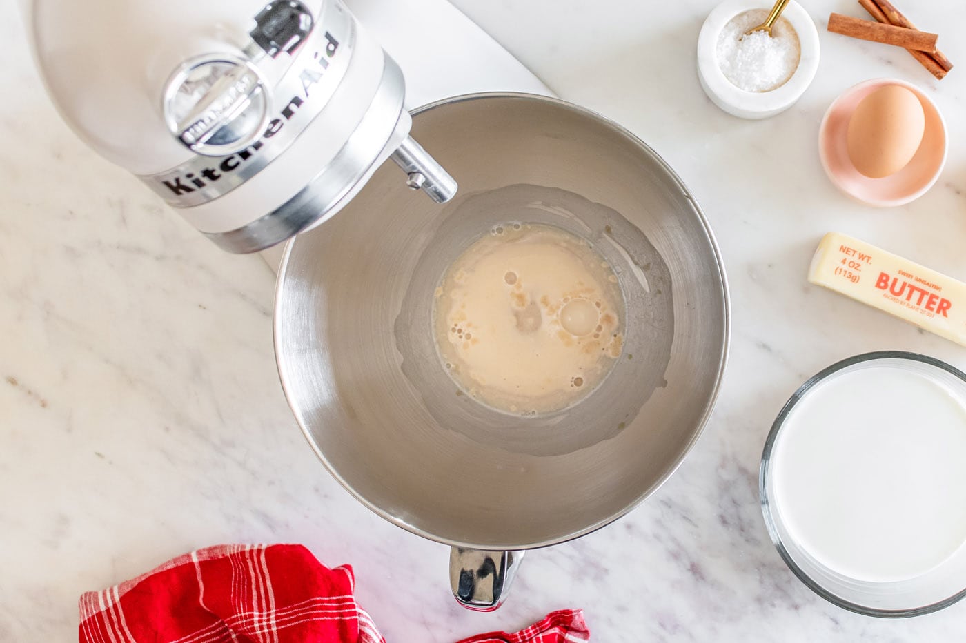 yeast, water, and sugar in a stand mixer bowl