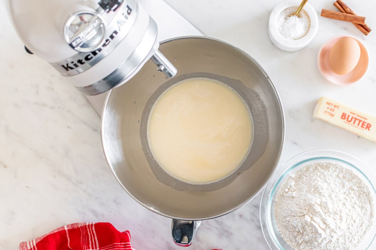 active yeast with milk in a stand mixer bowl