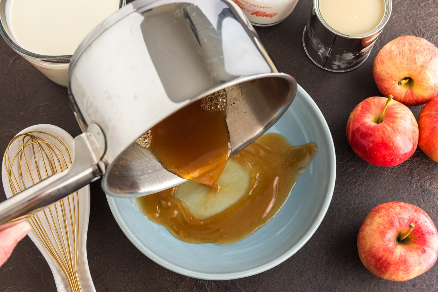 pouring apple cider onto a plate