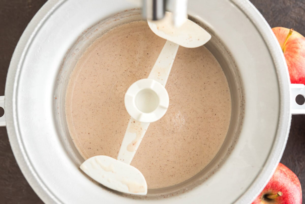 churning apple cider ice cream in an ice cream maker