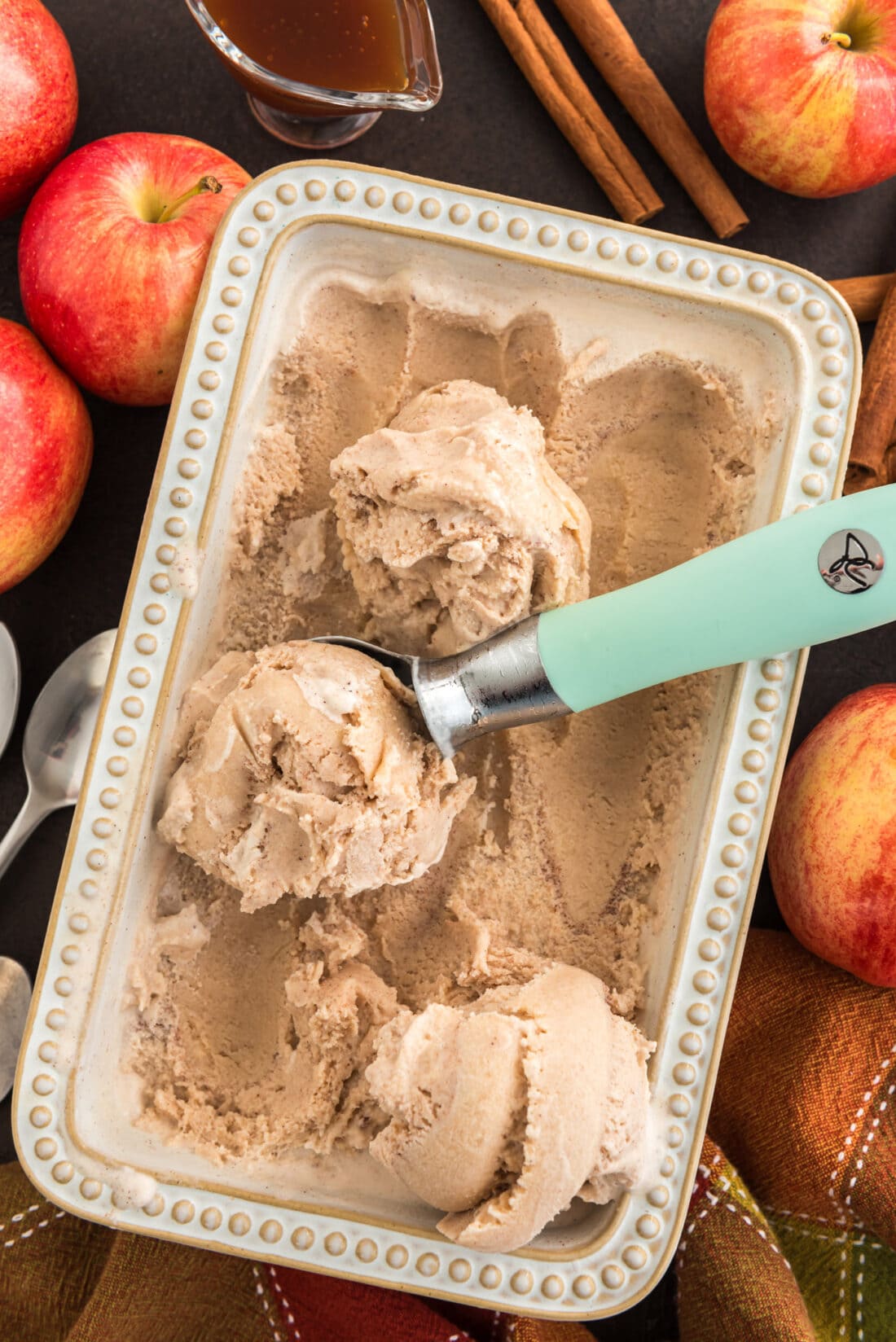 Pan of Apple Cider Ice Cream with an ice cream scoop