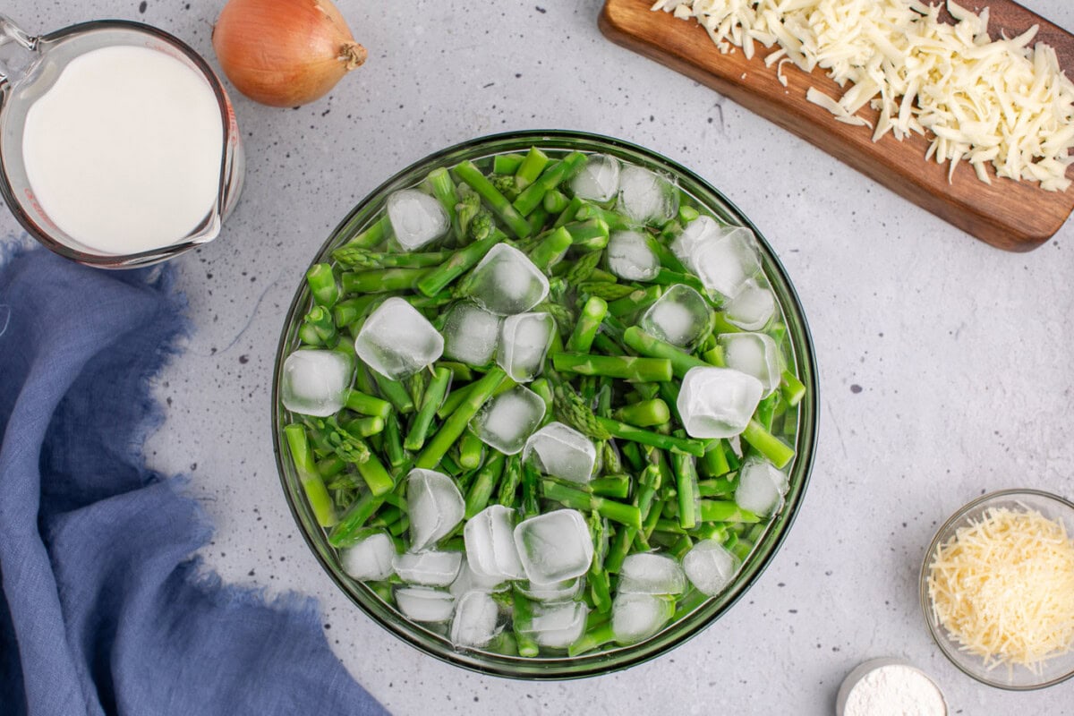 blanching asparagus in a bowl