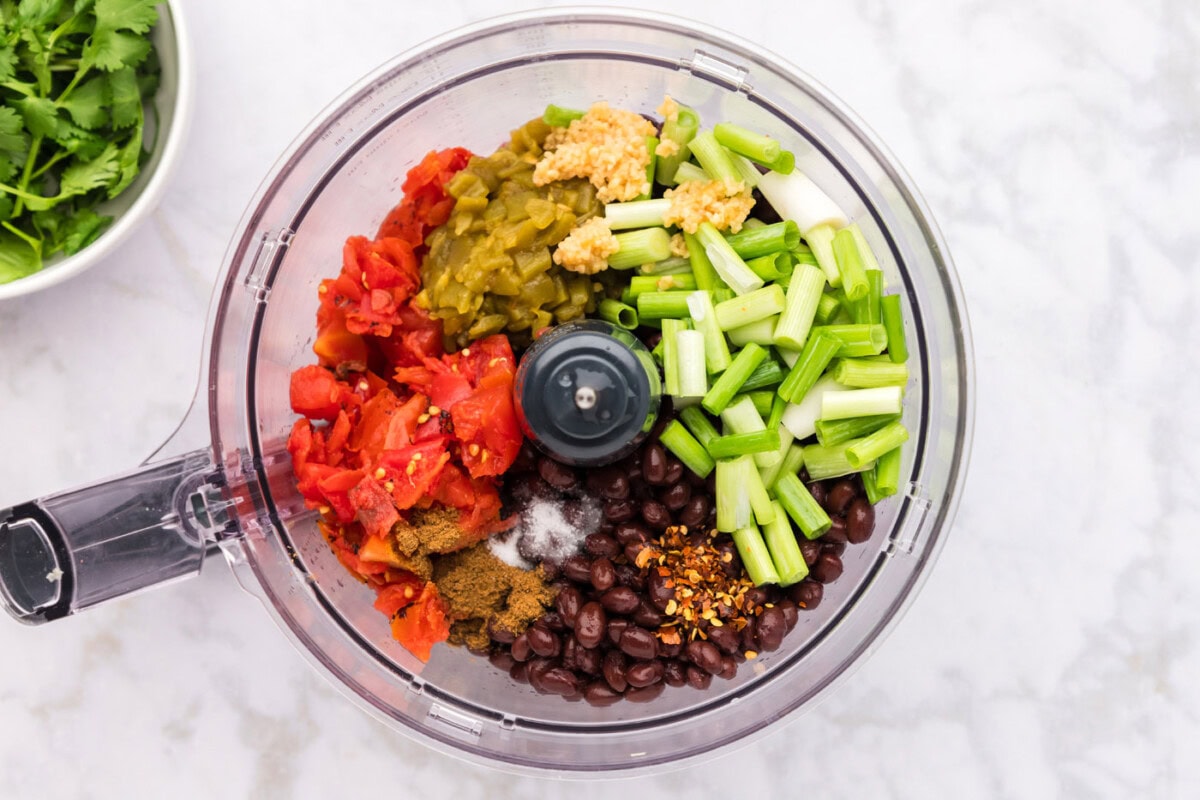 ingredents for black bean dip in a food processor